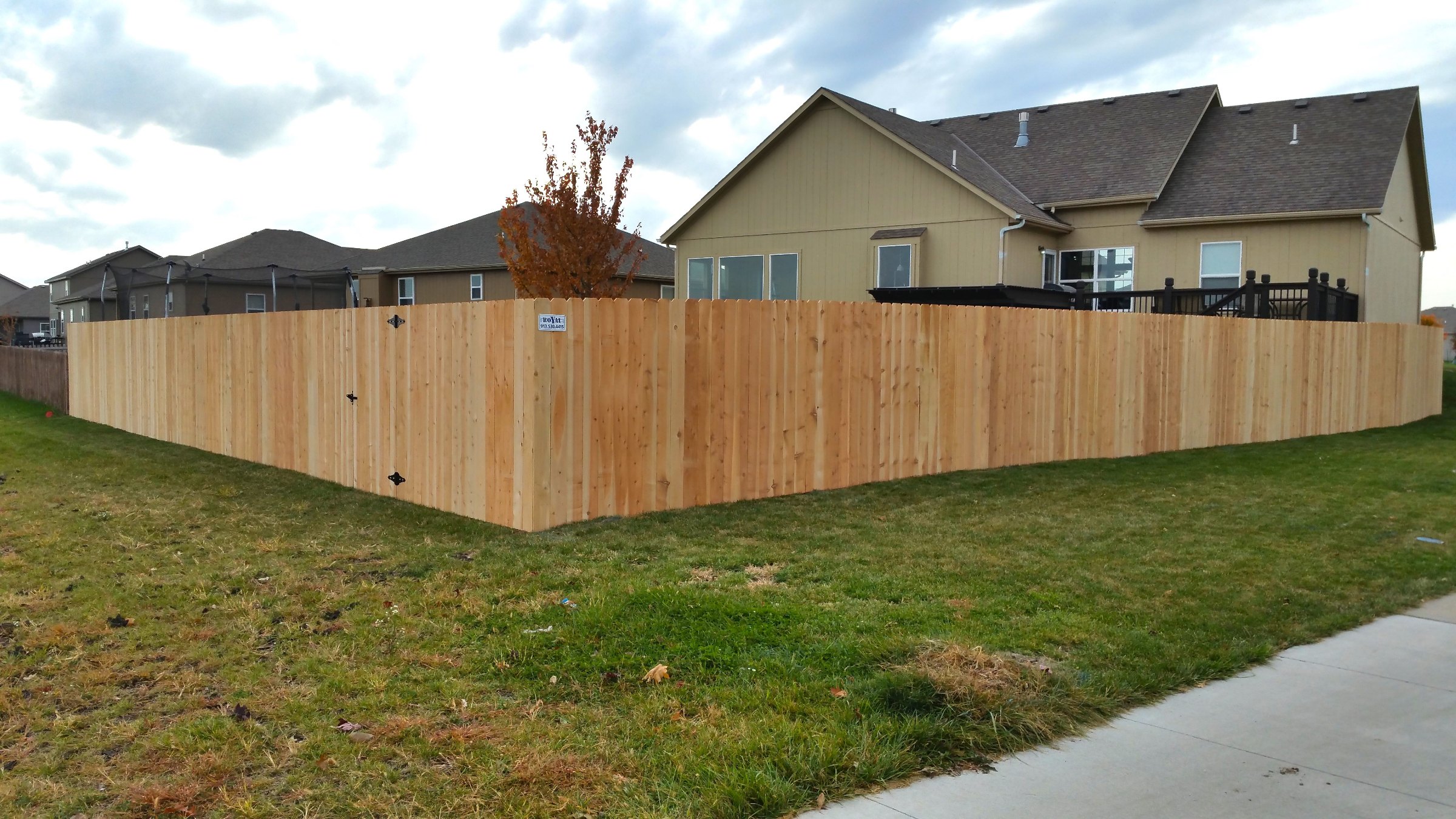 Six-foot standard cedar privacy fence around a backyard