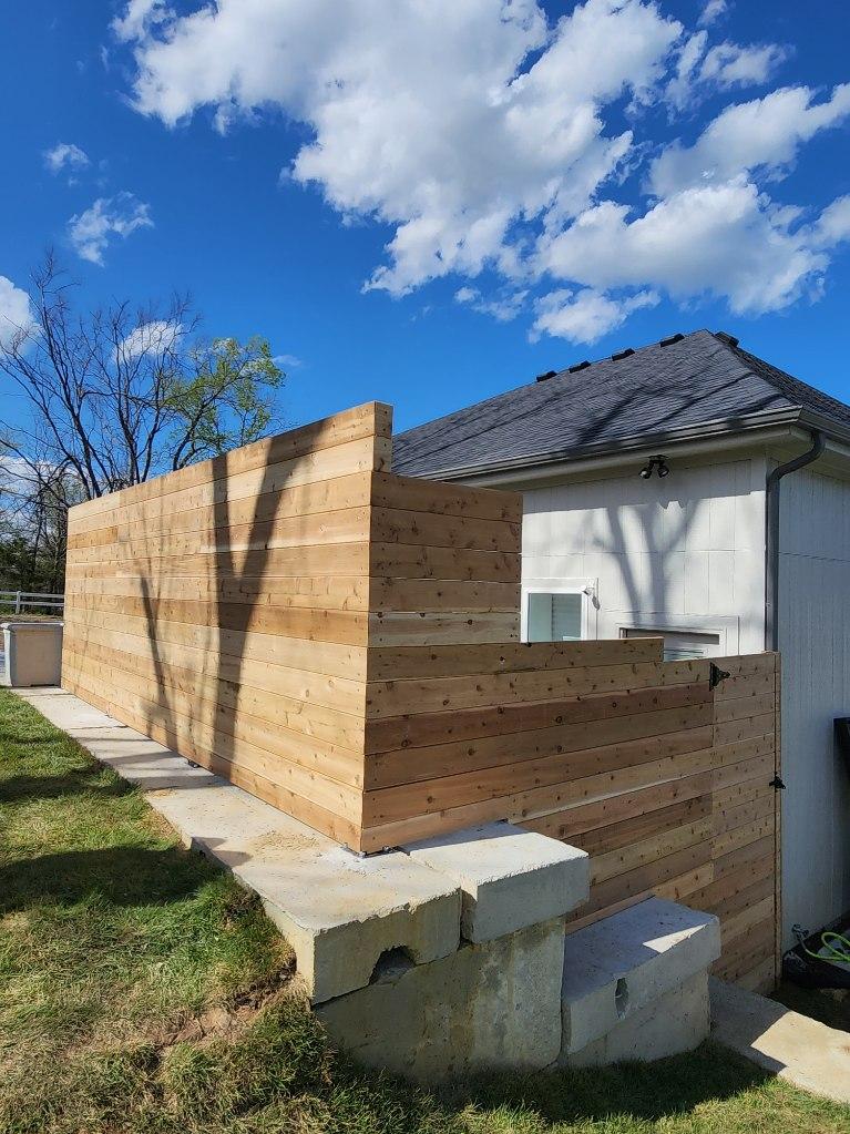 Six-foot horizontal premium cedar fence beside a home