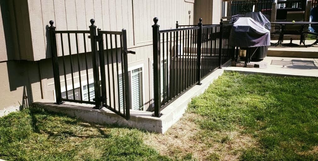 Ameristar Majestic Montage two-rail steel railing along a walkout patio