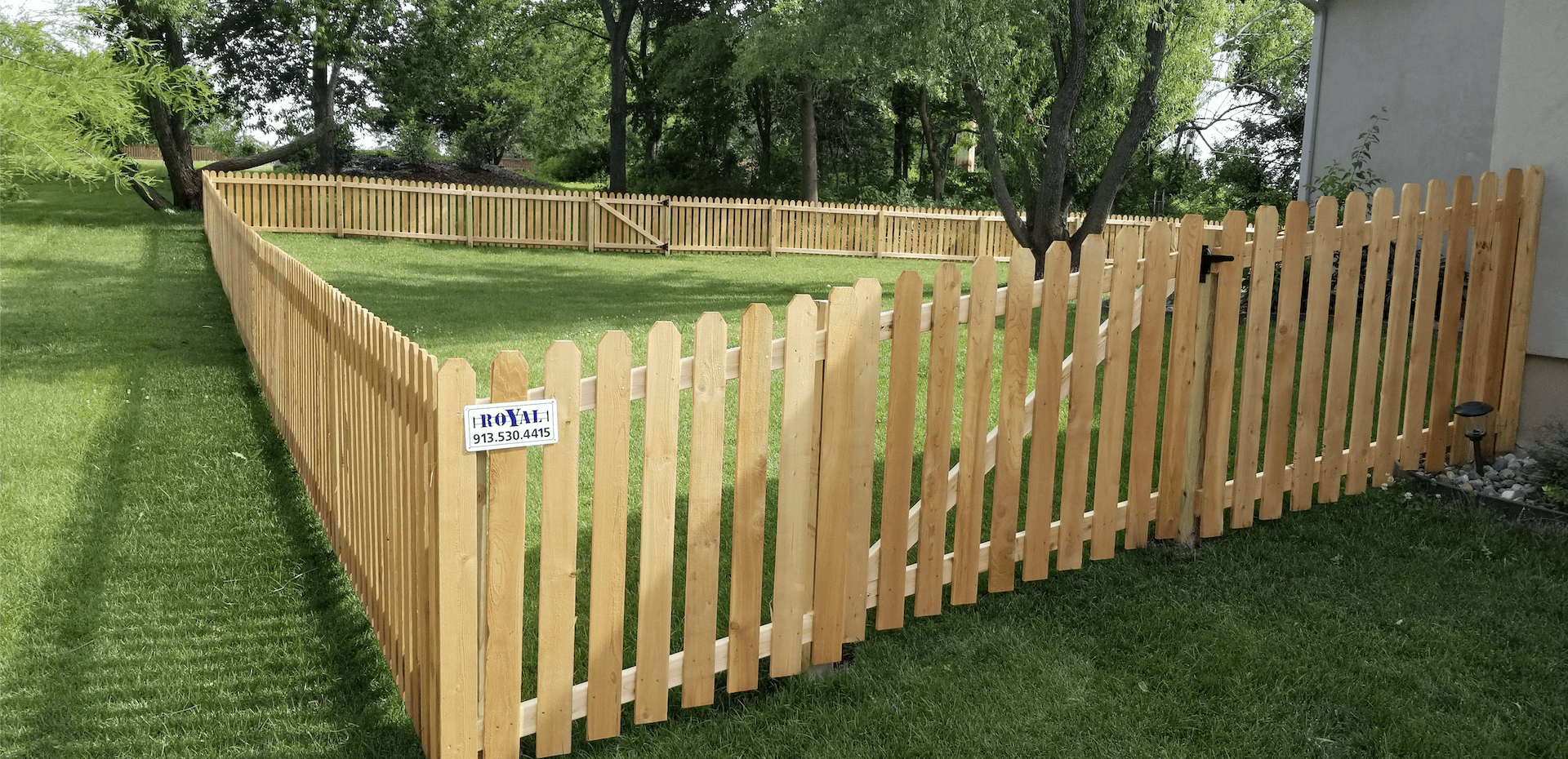 Four-foot spaced cedar fence with flat-top treated posts