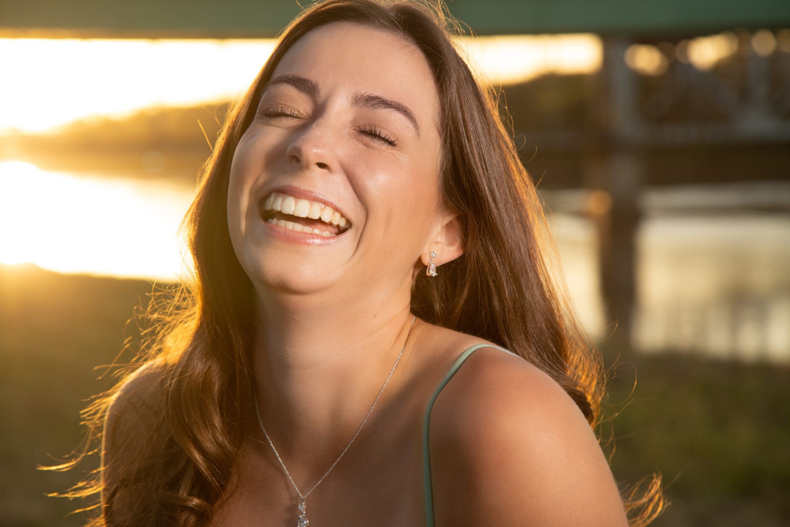 Laughing, in the last of the light